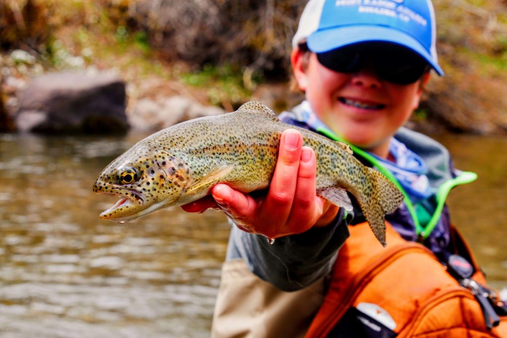 Boy holding a trout