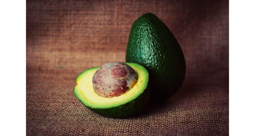Avocado with light green flesh near the pit